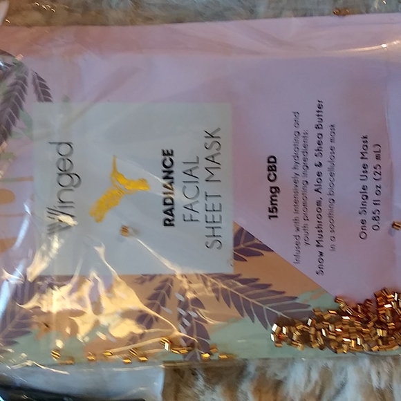 Gold Victoria's secret bag filled with a variety of beauty products. - Picture 7 of 13